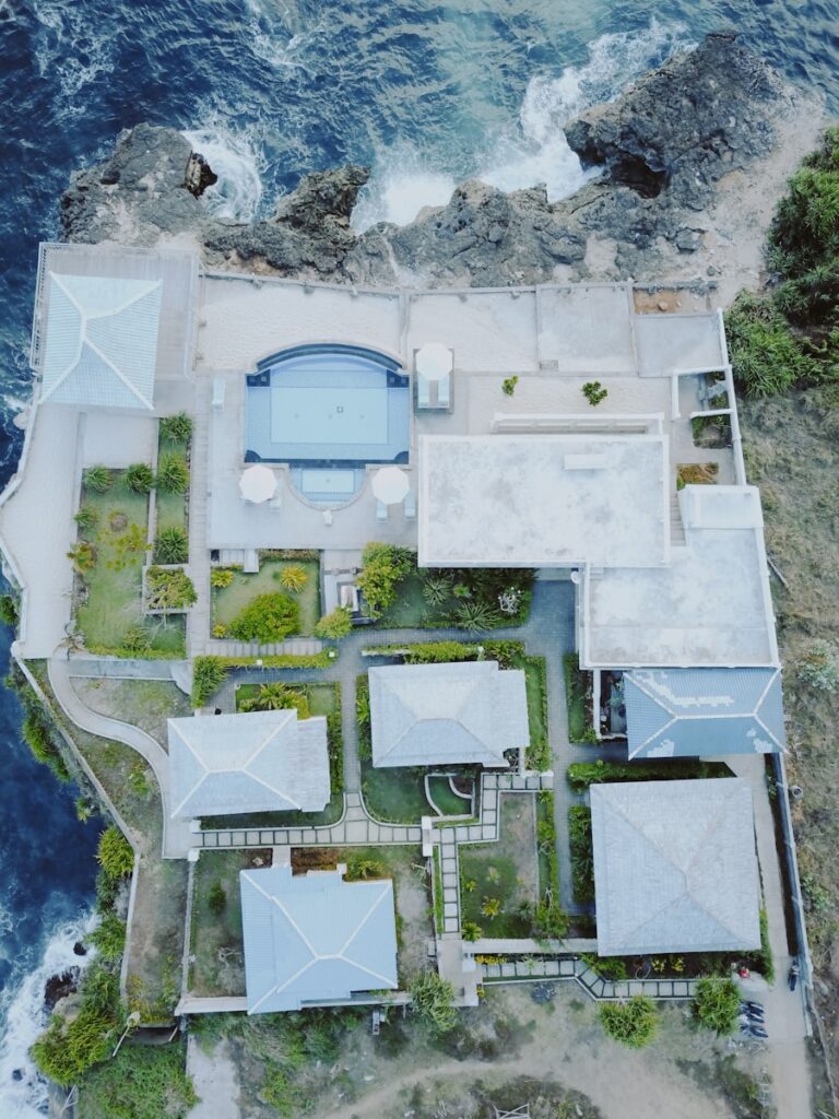 aerial view photography of house beside body of water