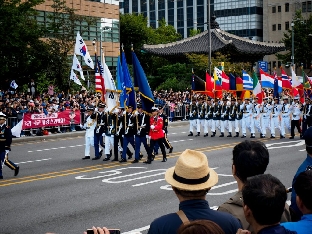 A group of people that are standing in the street