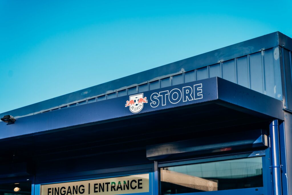a store front with a blue awning