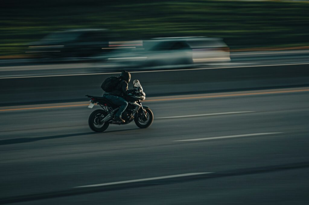 a person riding a motorcycle on a highway