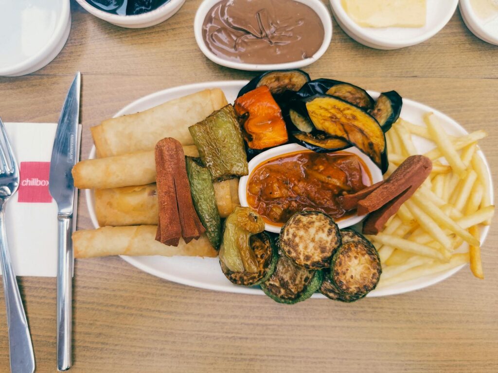 A diverse mix of fried vegetables, draws, and dips served in Gaziantep, Turkey.