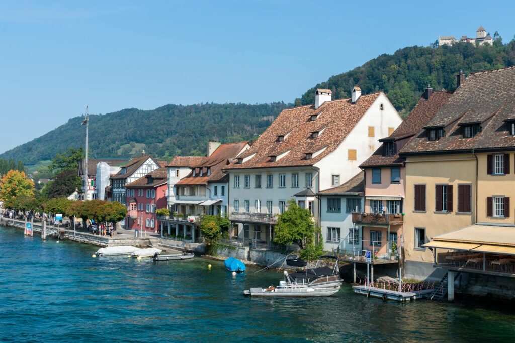 Picturesque view of colorful historic buildings by the Rhine River in Stein am Rhein, Switzerland.