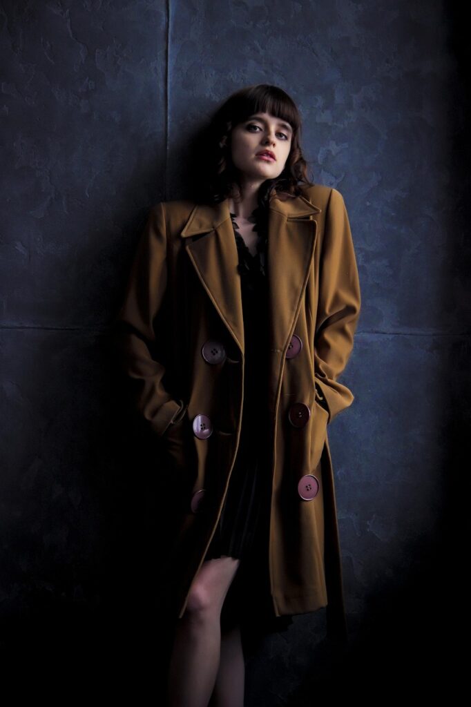 young woman, coat, old coat, brown coat, girl in coat, retro, dark background, model, style, beauty, sight, pose, hairstyle, photosession, wall, gorgeous, views, classic, legs, iphone wallpaper, coat, coat, coat, coat, coat