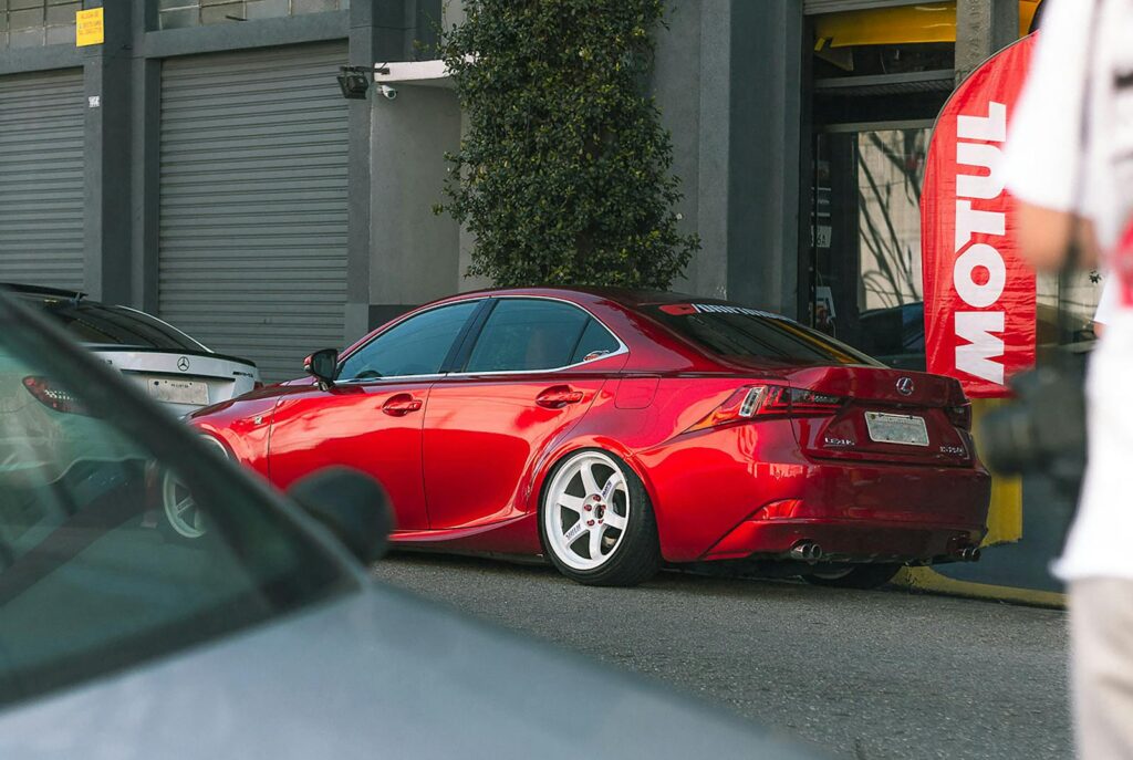 A sleek red Lexus car parked outdoors in São Paulo, showcasing luxury automotive design.