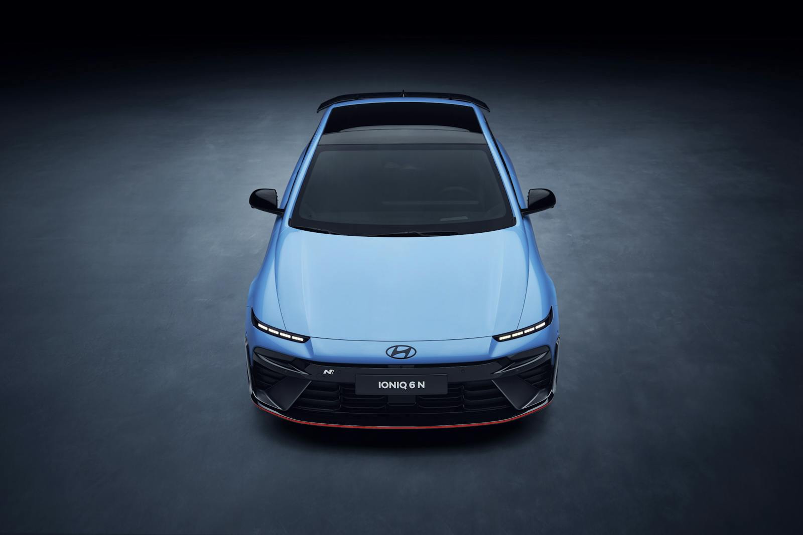 Front view of the Hyundai Ioniq 6 N electric vehicle with sophisticated design and lighting.