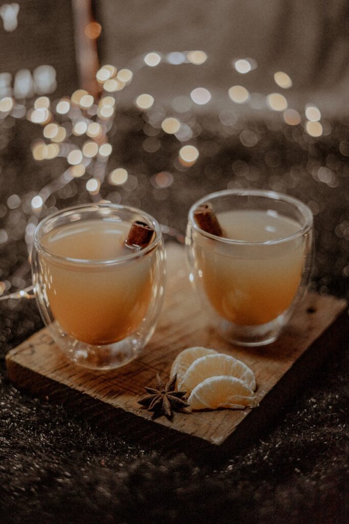 Warm spiced tea with citrus slices and star anise, perfect for a cozy winter evening.