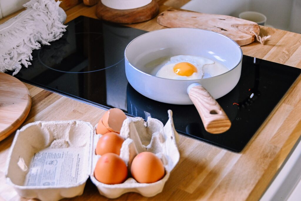 a bowl of eggs and a bowl of eggs on a stove