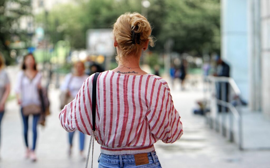 woman, tattoo, standing, urban, city, summer, warm, girl, pretty, sidewalk, street, young, recreation, relaxation, snapshot, jeans, nature, shirt, stripped, red