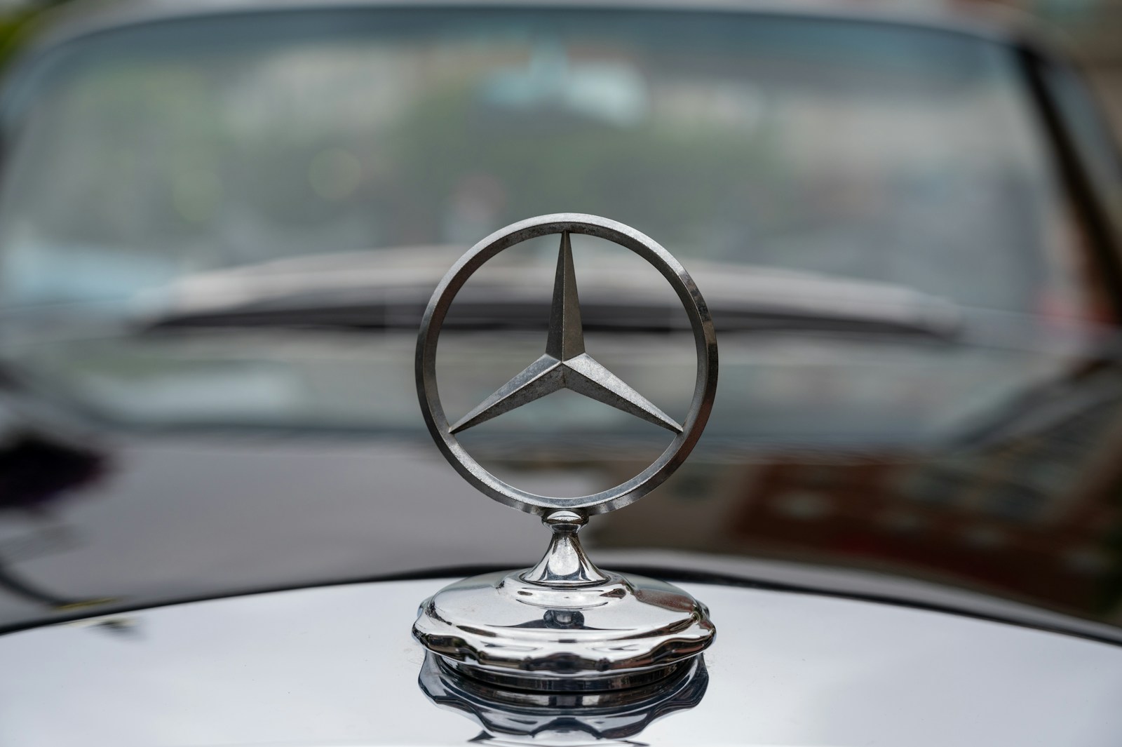 a mercedes emblem on the hood of a car