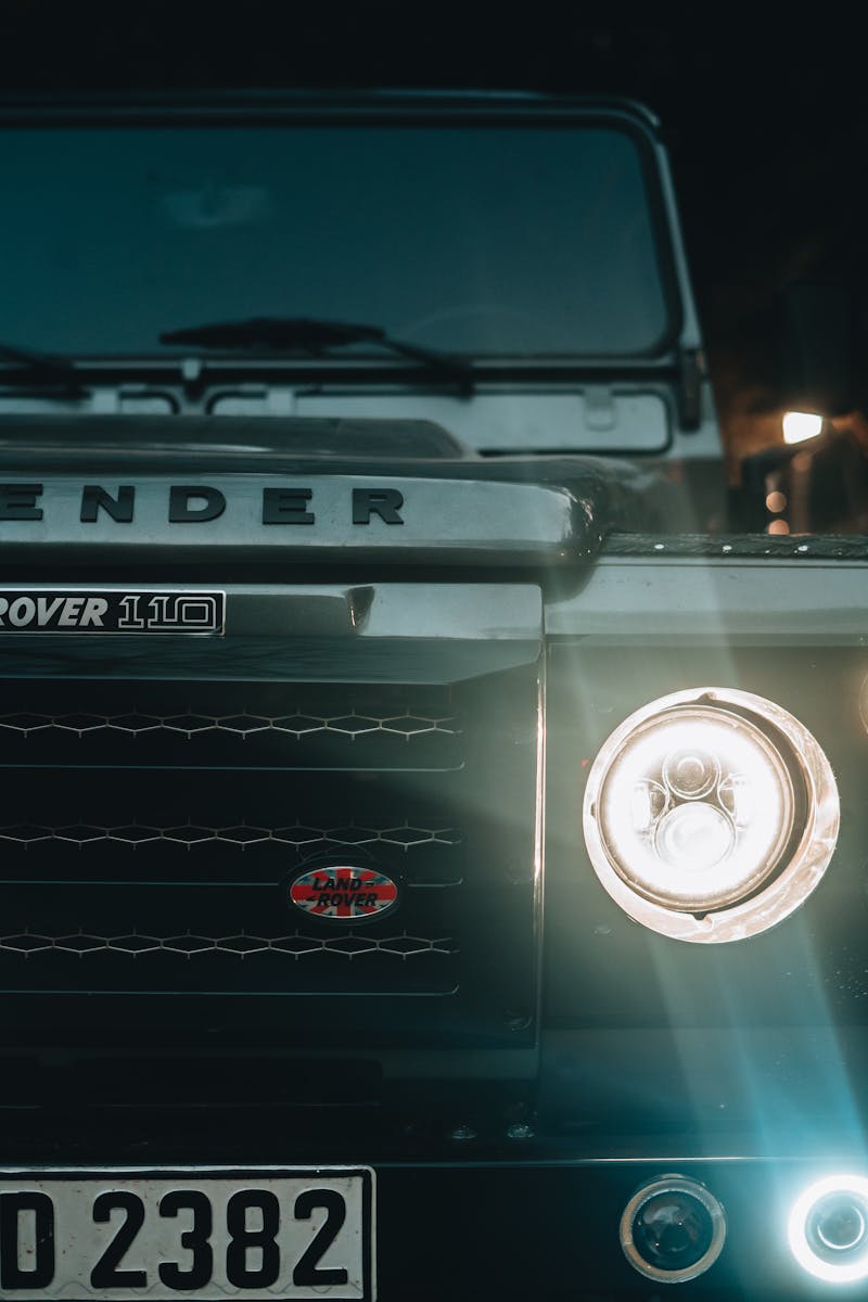 Land Rover Defender 110 close-up in Istanbul at night, showcasing rugged automotive design.