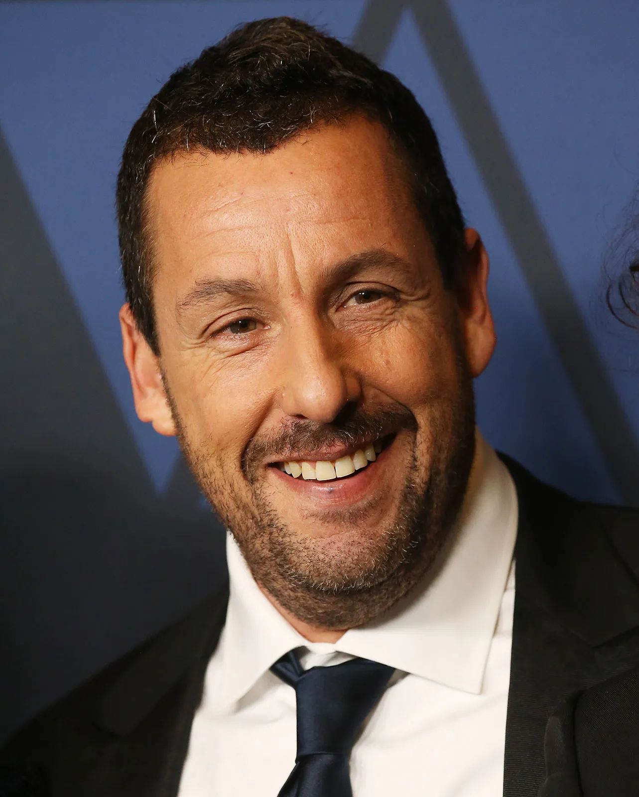 Adam Sandler: The Goofy Comedian with a Heart of Gold