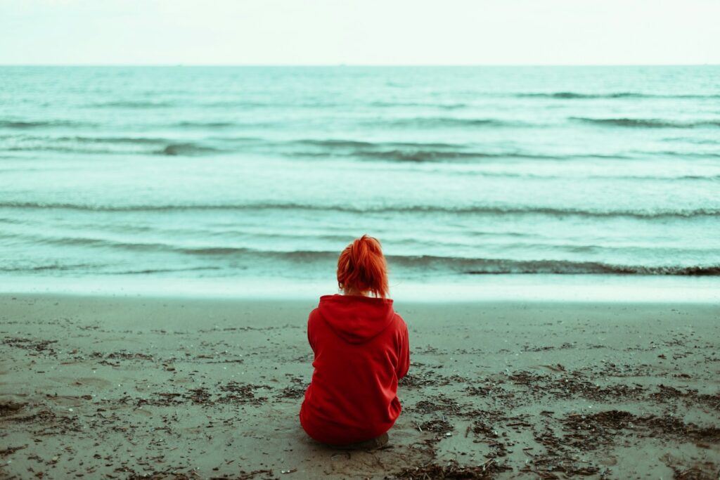 a child sitting on a beach