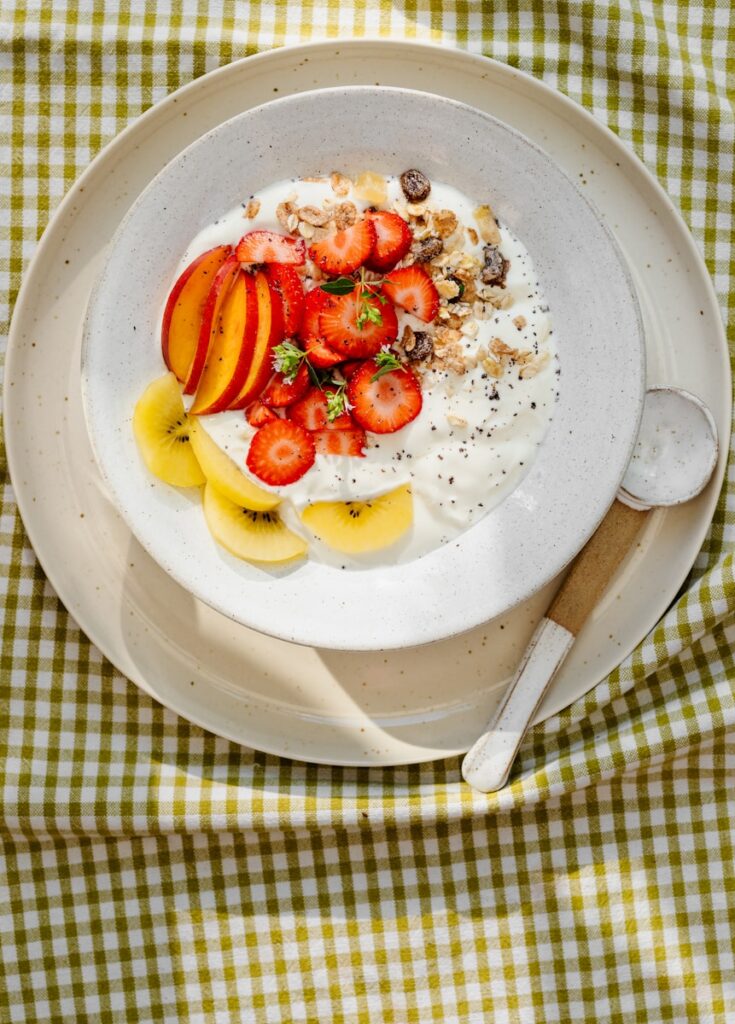 A bowl of yogurt with fruit on top
