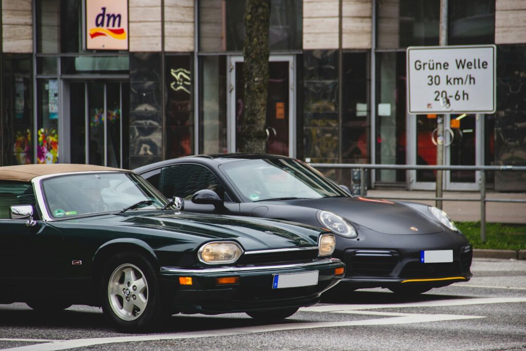 black porsche 911 parked in front of store