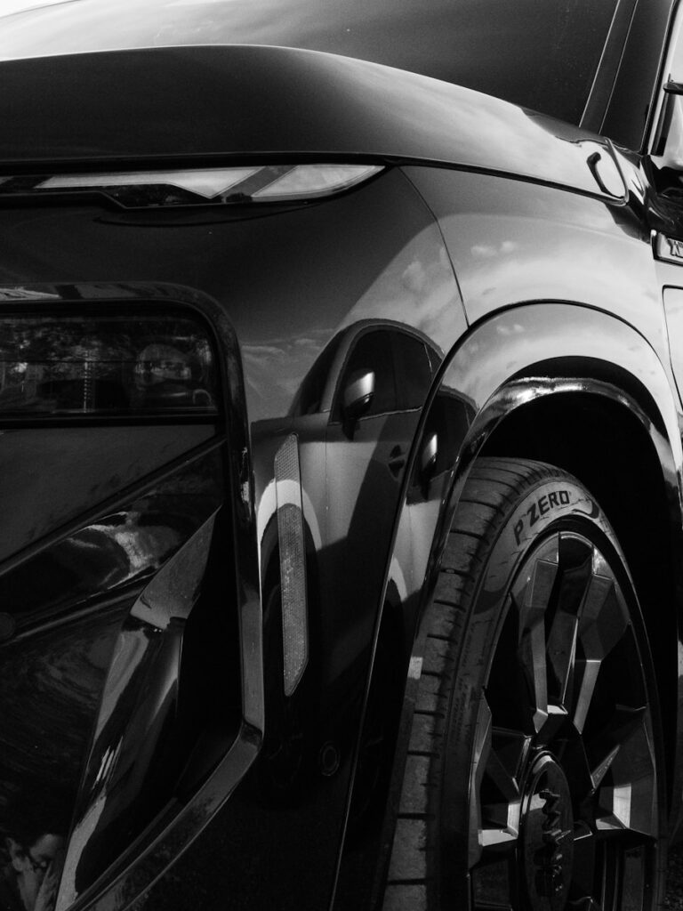 A black and white photo of a parked car