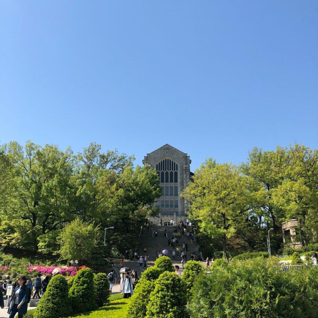 a group of people walking around a lush green park