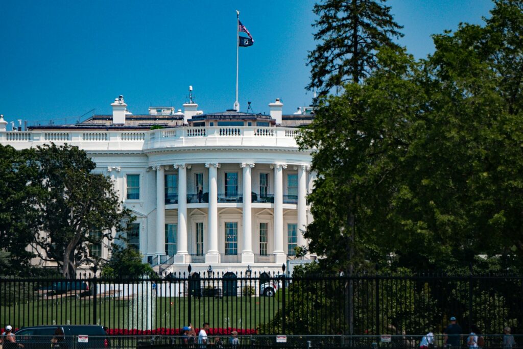 a large white building with a flag on top of it