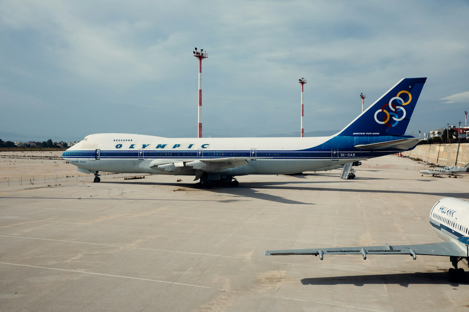 Olympic airliner at airport during daytime