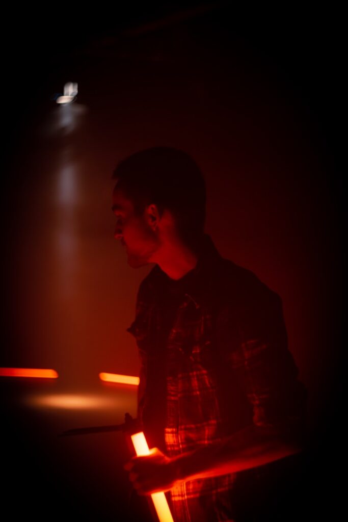 man holding light fixture