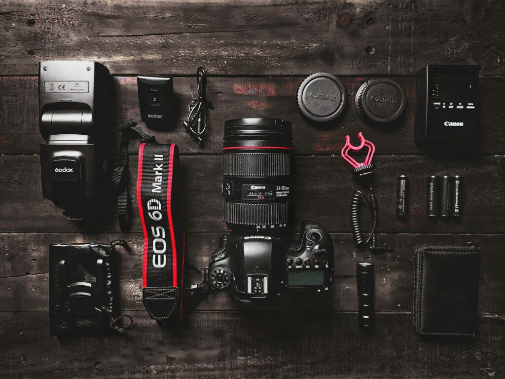 black and red nikon dslr camera