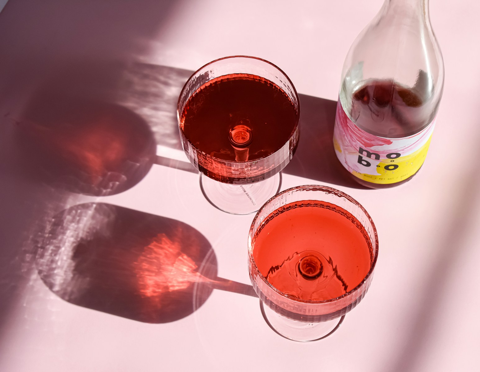 a bottle of wine and two glasses of wine