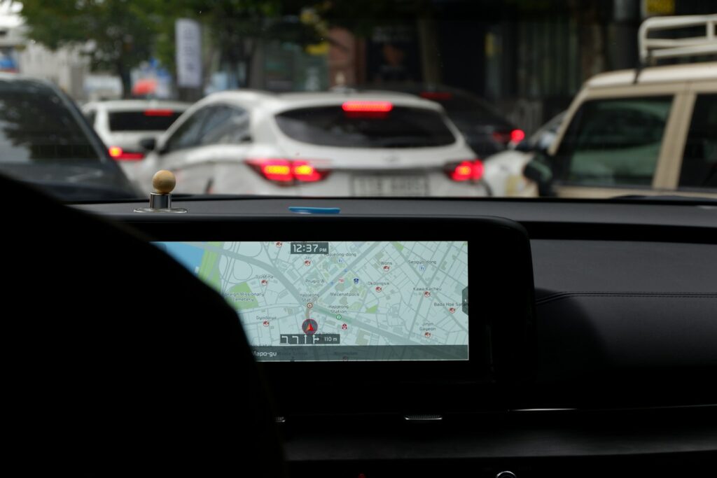 A car with a gps device on the dashboard
