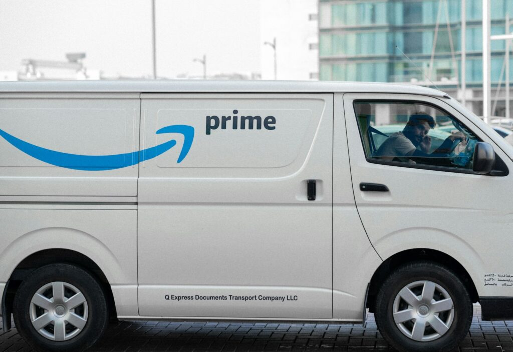 a white van with the amazon prime logo on it