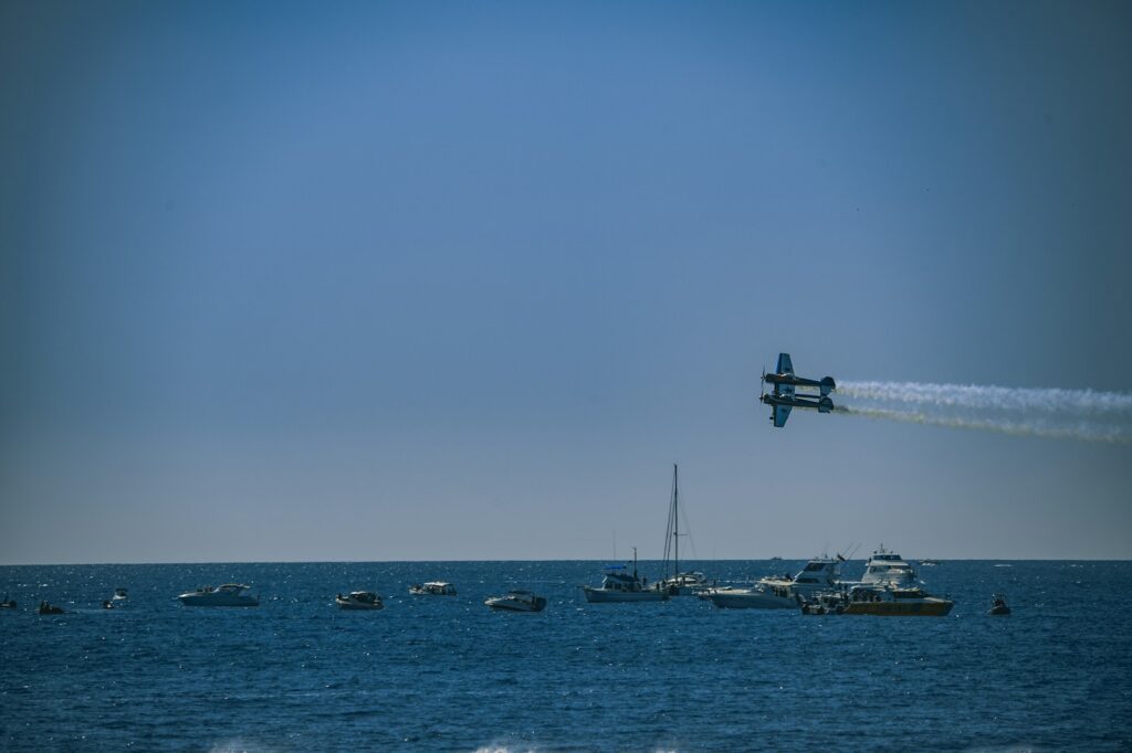 A plane flying over a body of water