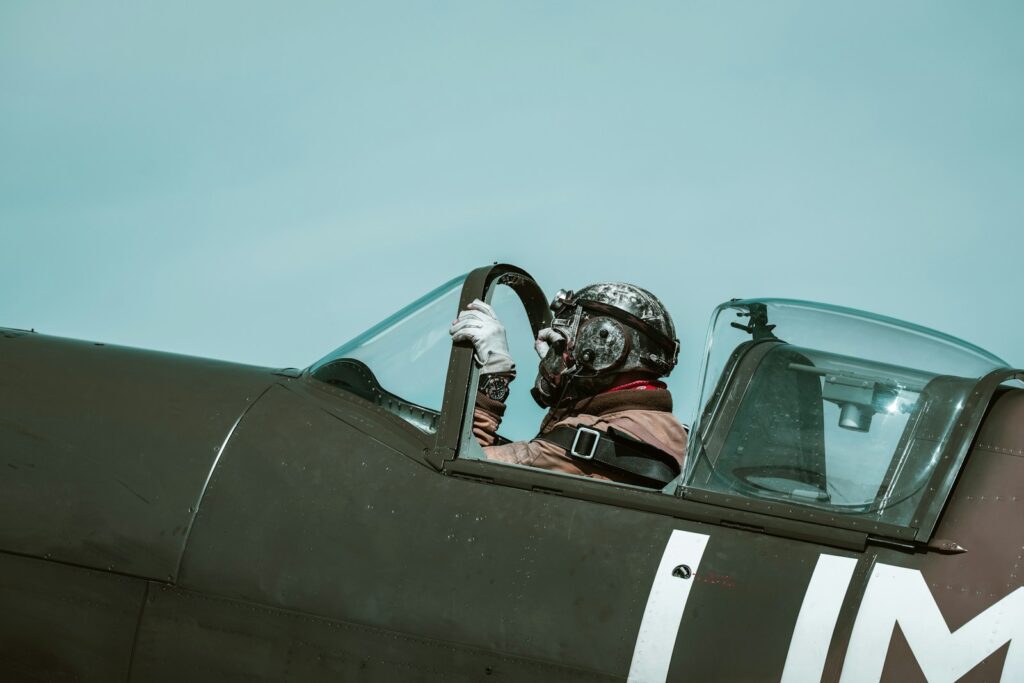 a man sitting in the cockpit of a fighter jet