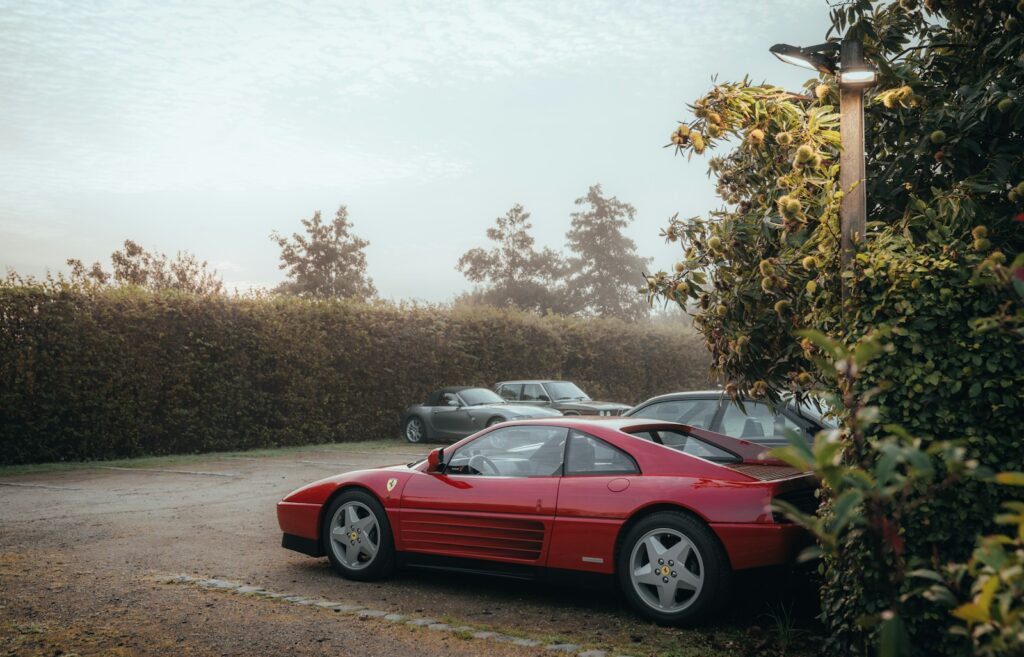 a red sports car parked in a parking lot