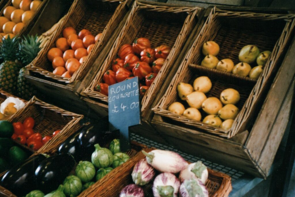 assorted fruits on brown wooden crate