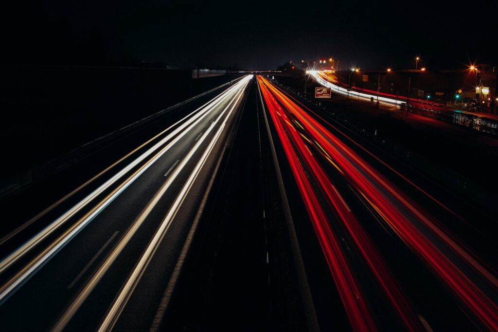 time lapse photography of cars on road during night time