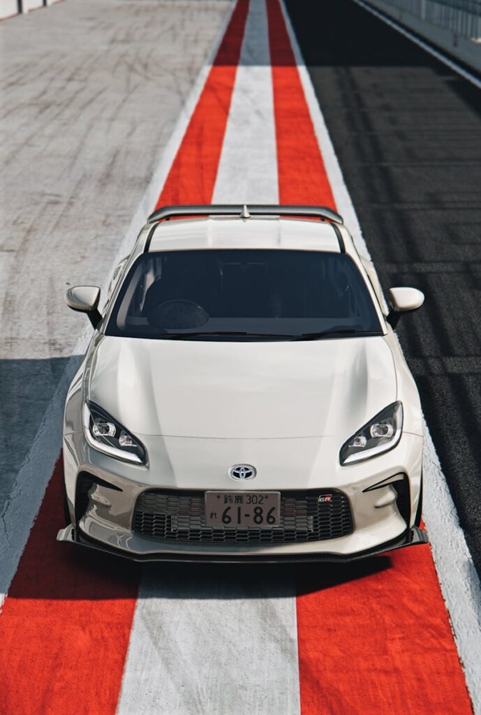 Front view of a Toyota GR86 on a racing track in Spielberg, Austria.