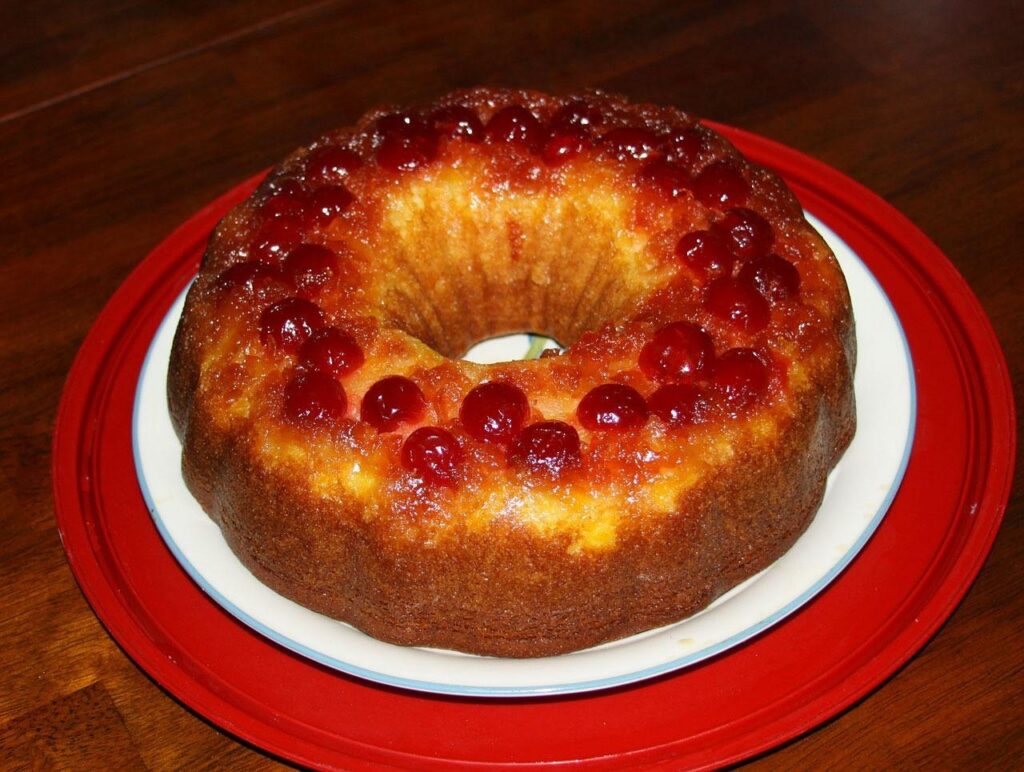 cake, pineapple, upside, down, cherries, cherry, toppings, brown, sweet, desserts, food, baked, pastry, delicious, comfort, sugar, tasty, yellow, snack, red, white, plates, table, brpwn, brown cake, brown pineapple, cake, pineapple, pineapple, pineapple, pineapple, pineapple