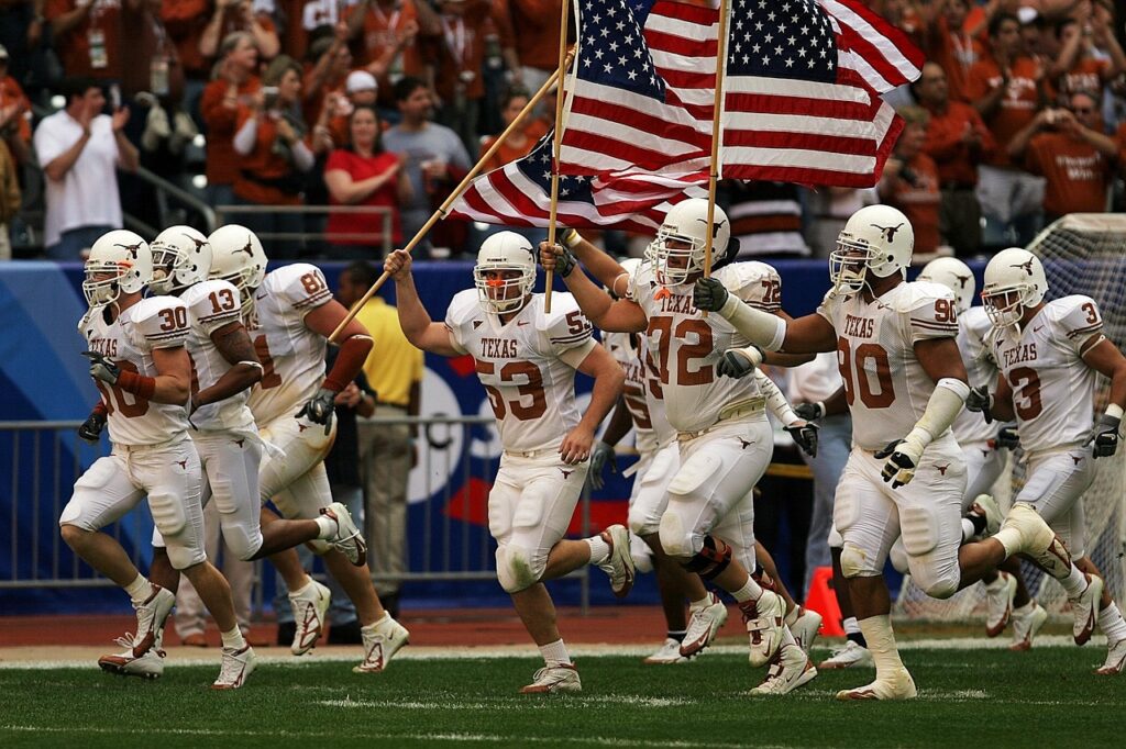 american football, football team, game, sport, competition, american football player, american football field, athlete, teamwork, grass, college, players, flags, opening ceremonies, male, university, texas, texan, excitement, men, celebration, helmets, longhorns, celebrating, running, team, brown team, nature, brown running, brown football, brown gaming, brown sports, brown run, brown game, brown games, brown teamwork, brown celebrate
