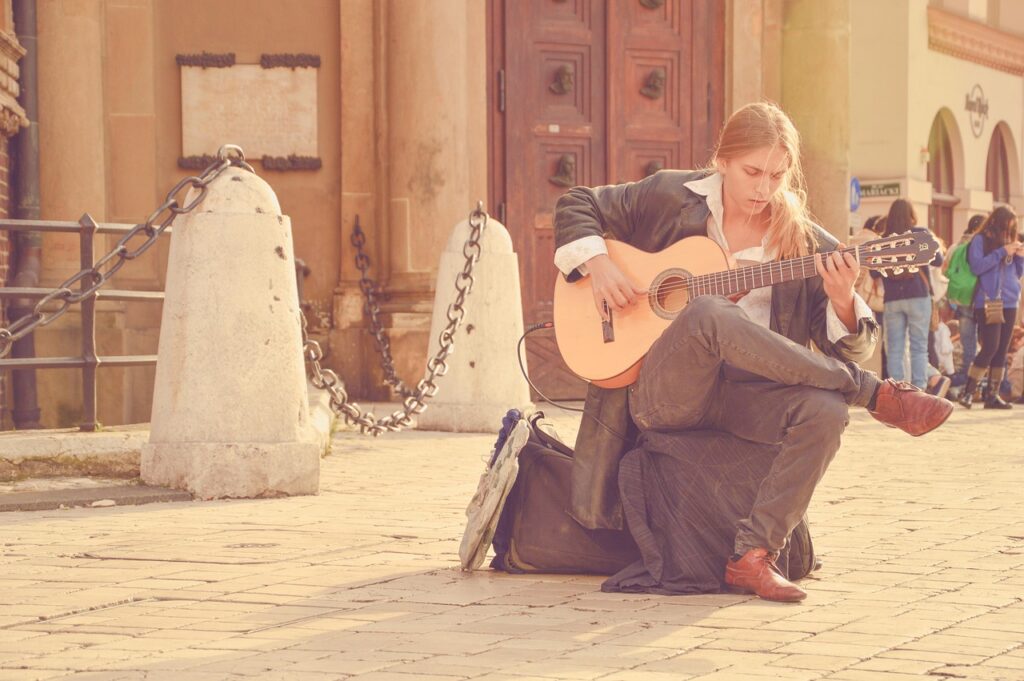 guitarist, street performer, man, playing music, playing guitar, acoustic guitar, blonde man, long hair, music, musician, playing, sitting, street musician, sunny day, guitarist, guitarist, man, playing music, playing guitar, playing guitar, blonde man, music, music, music, musician, musician, musician, musician, musician, playing, street musician, sunny day, sunny day, sunny day, sunny day