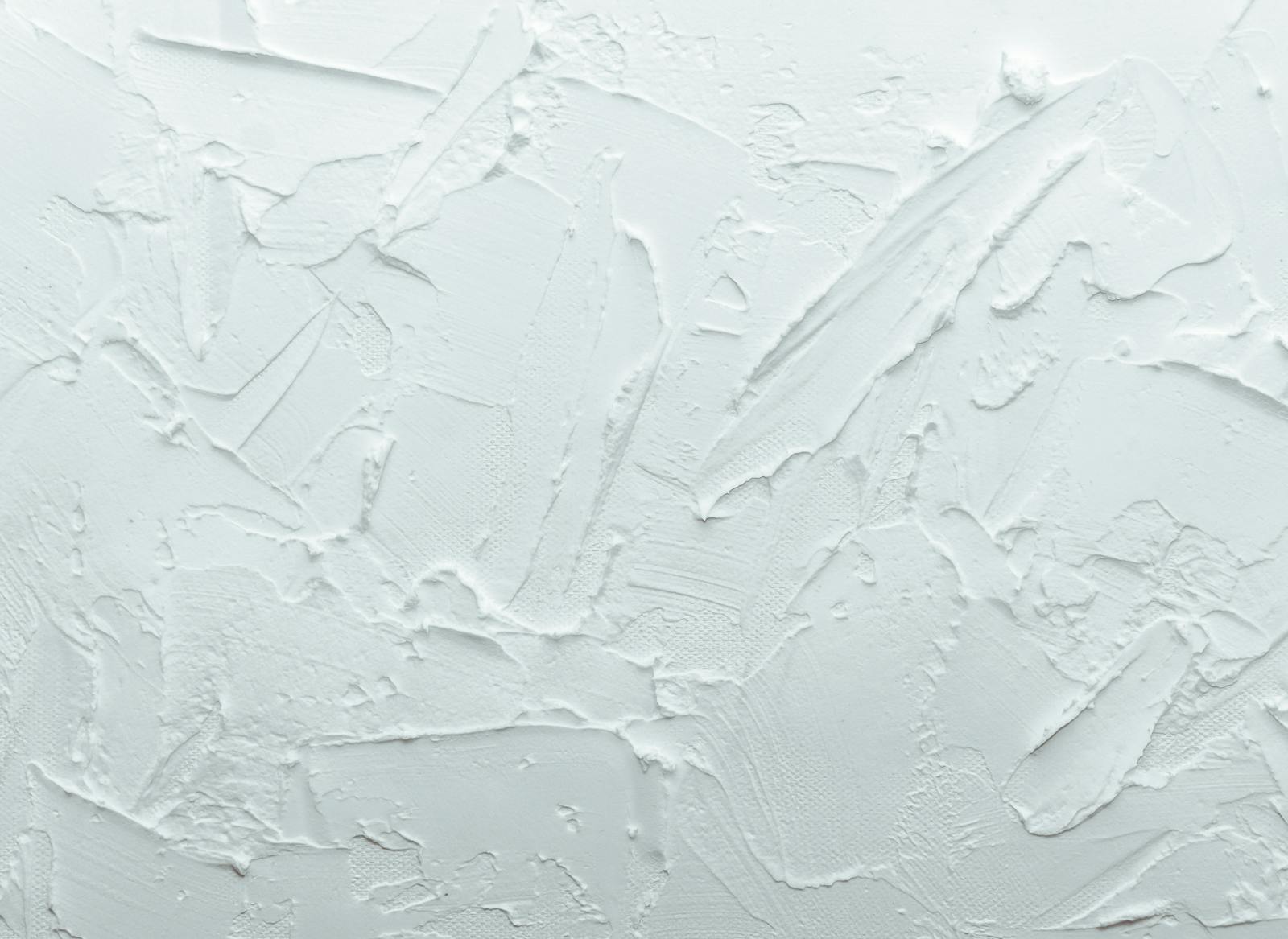 Close-up shot of a white textured surface with abstract patterns, ideal for design backgrounds.