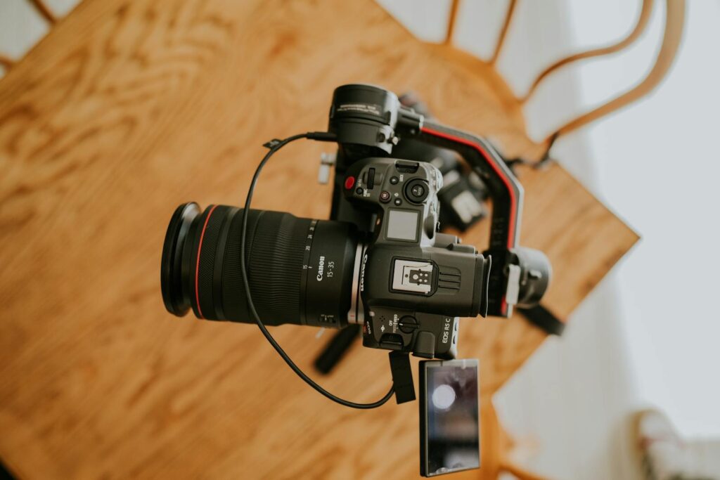 Top view of a professional camera setup on a tripod indoors, perfect for photography enthusiasts.