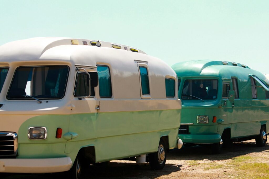 white and green van on road during daytime
