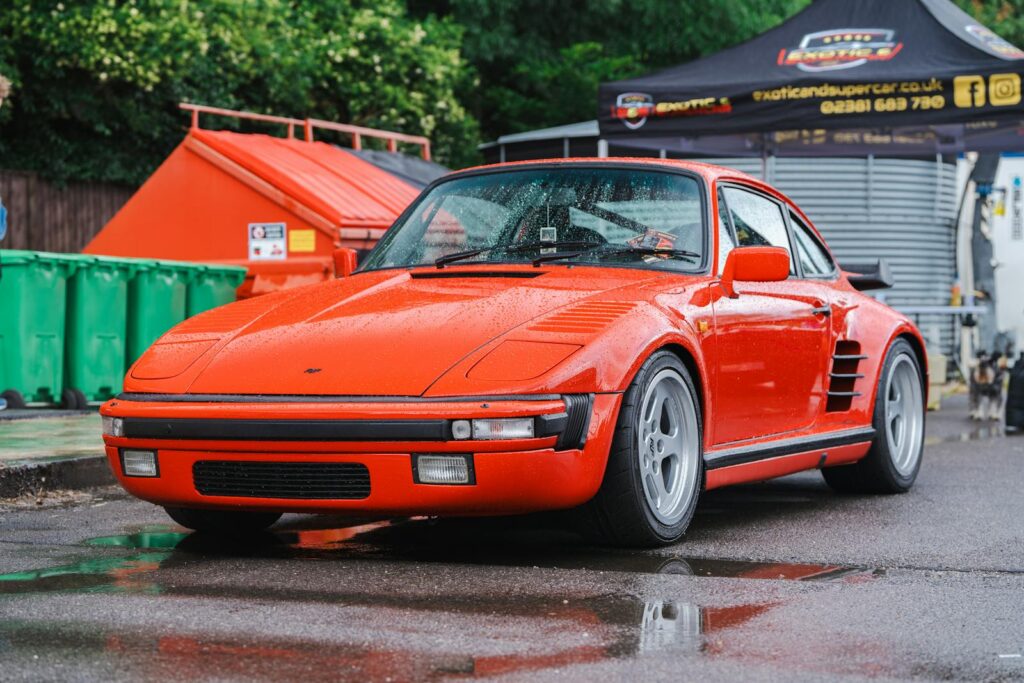 Vibrant red Porsche 911 photographed at a car event in Southampton, England.