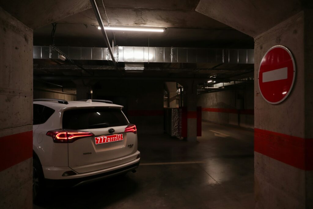 a white car parked in a parking garage