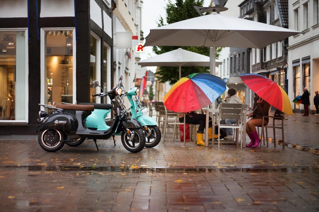 electric scooter, scooter, street, rain, umbrella, woman, cafe, conversation, nature, retro