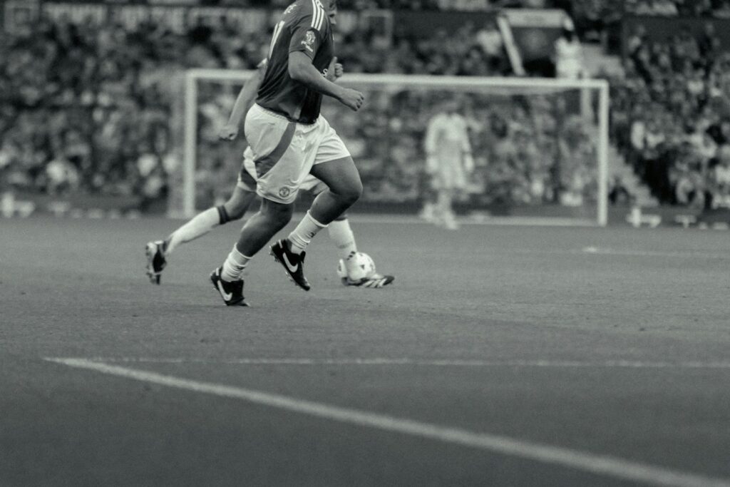 A group of men playing a game of soccer