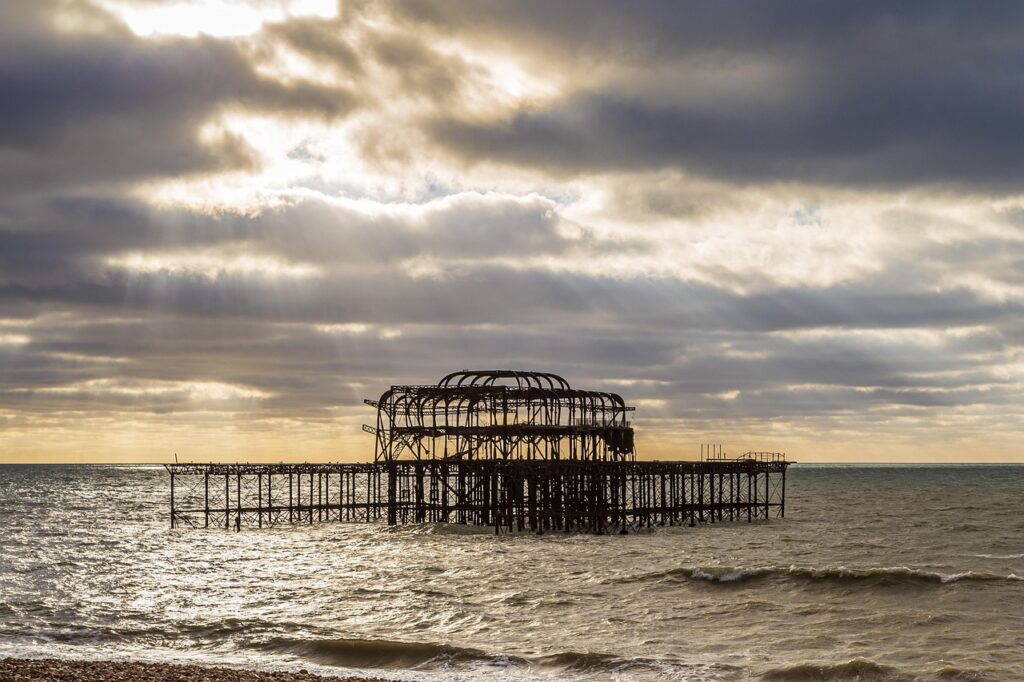 brighton, nature, england, sussex, sea, pier, seaside, west pier, storm, sun rays, brown storm