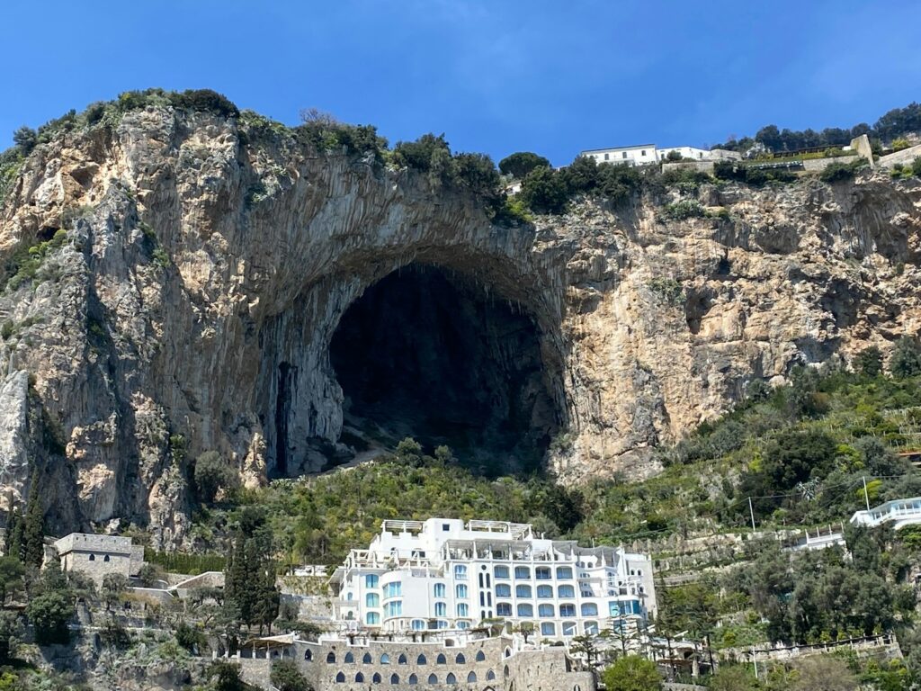 A large cave in the side of a mountain