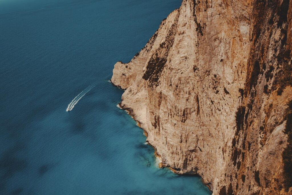 boat, vessel, waves, rocks, cliff, zakynthos, greece, travel, holiday, ocean, sea, water, coast, island, travelling, nature, summer, transport, landscape