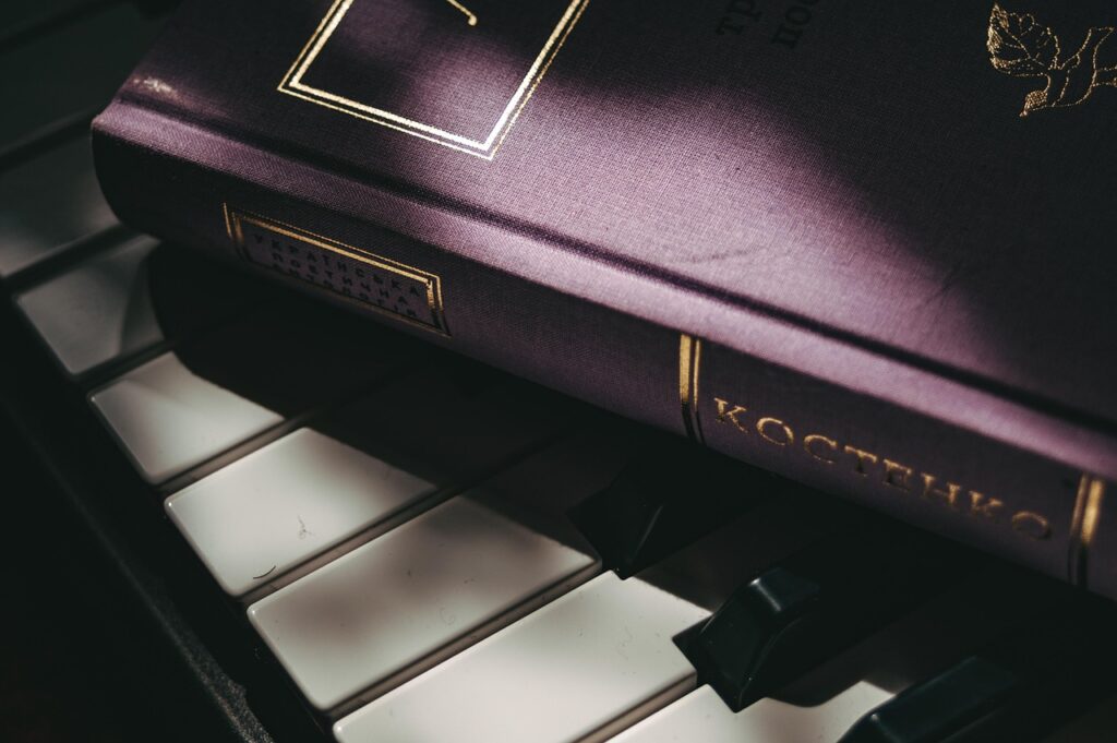 book, synthesizer, keys, melody