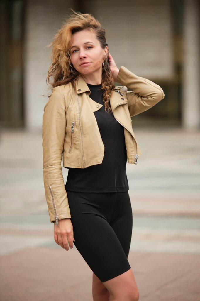 woman, portrait, leather jacket, cycling shorts, fashion, style, street portrait, street photo session, curly, demi-season image