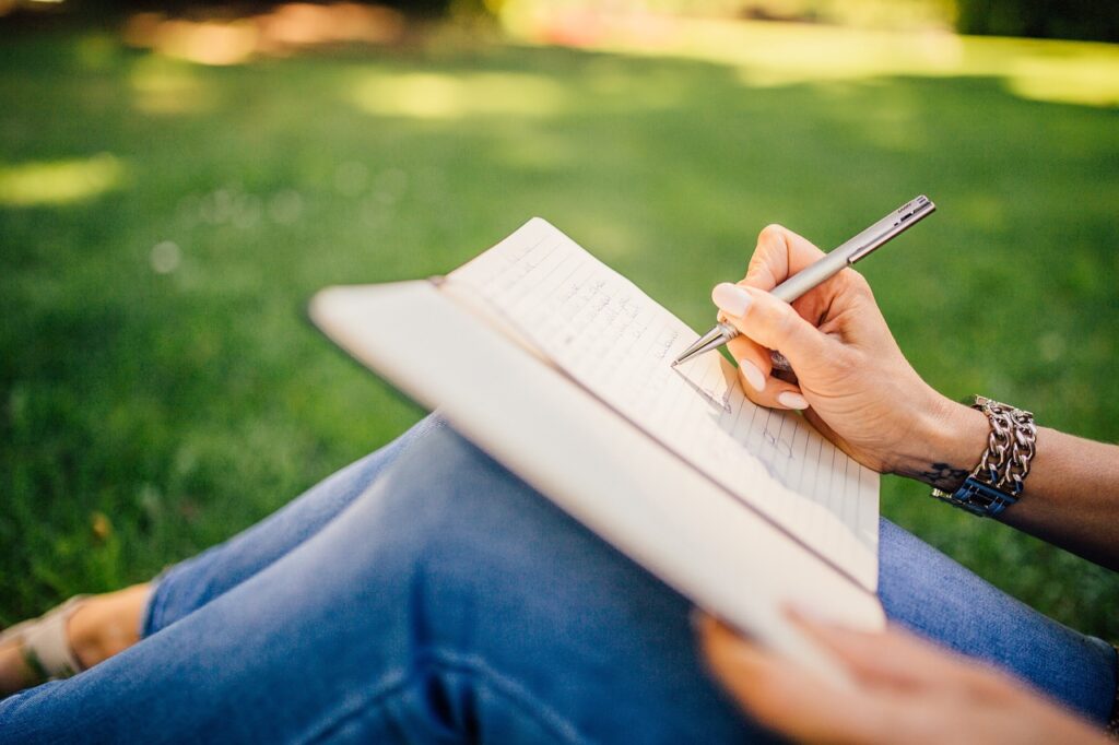writing, writer, nature, notes, pen, notebook, book, girl, woman, people, hands, grass, outdoors