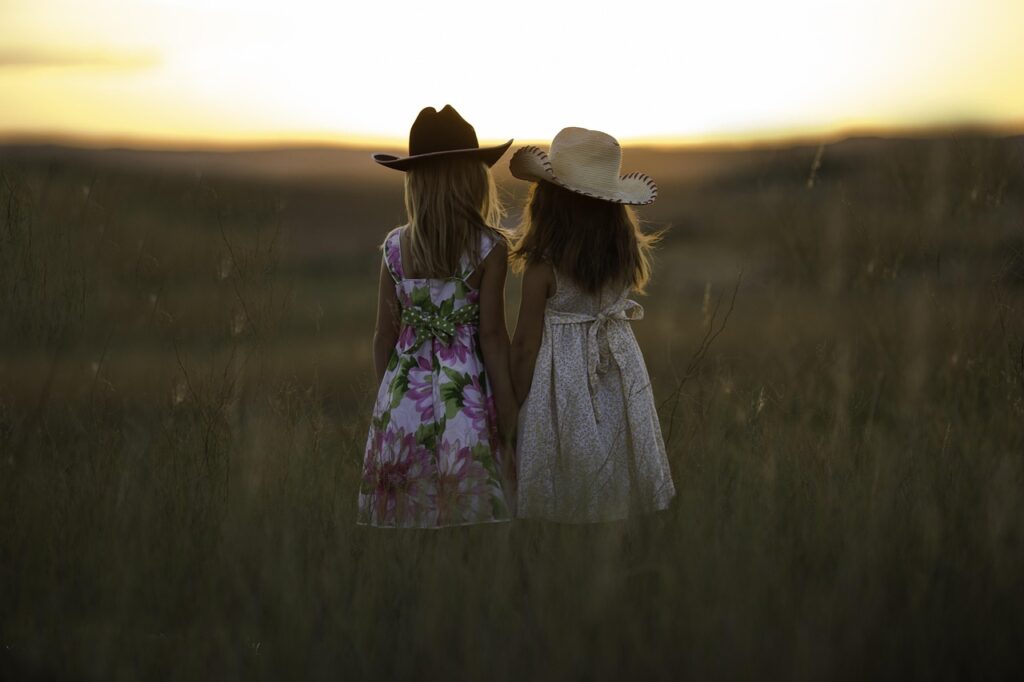 sisters, nature, summer, children, girls, childhood, siblings, holding hands, hats, dusk, outdoors, fields, rural, countryside, dresses